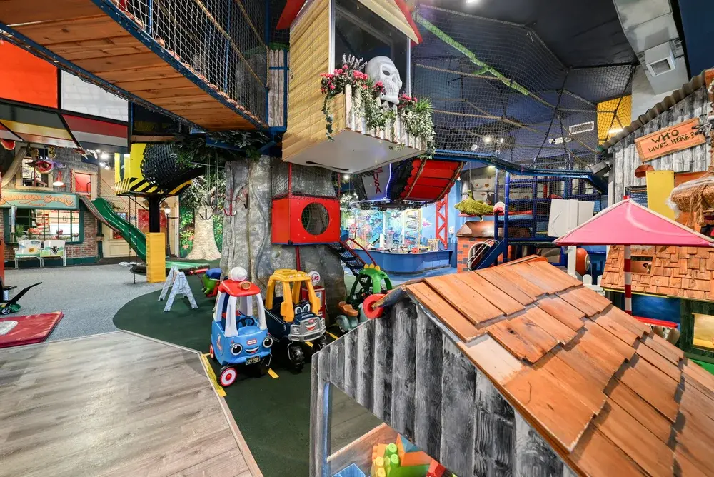Children sliding down the indoor slides