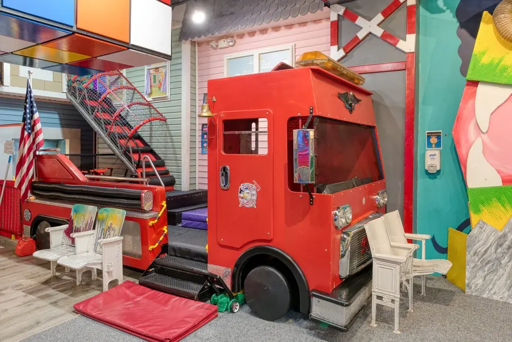 Children sliding down the indoor slides